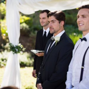 groom-standing-with-waiter-and-groomsman-in-park-2026-01-09-11-09-45-utc.jpg